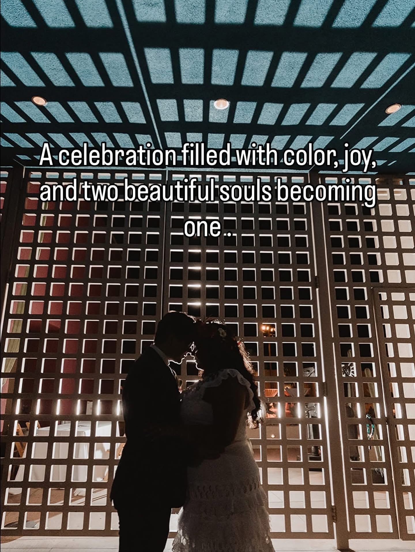 Newlyweds in a dramatic architectural setting