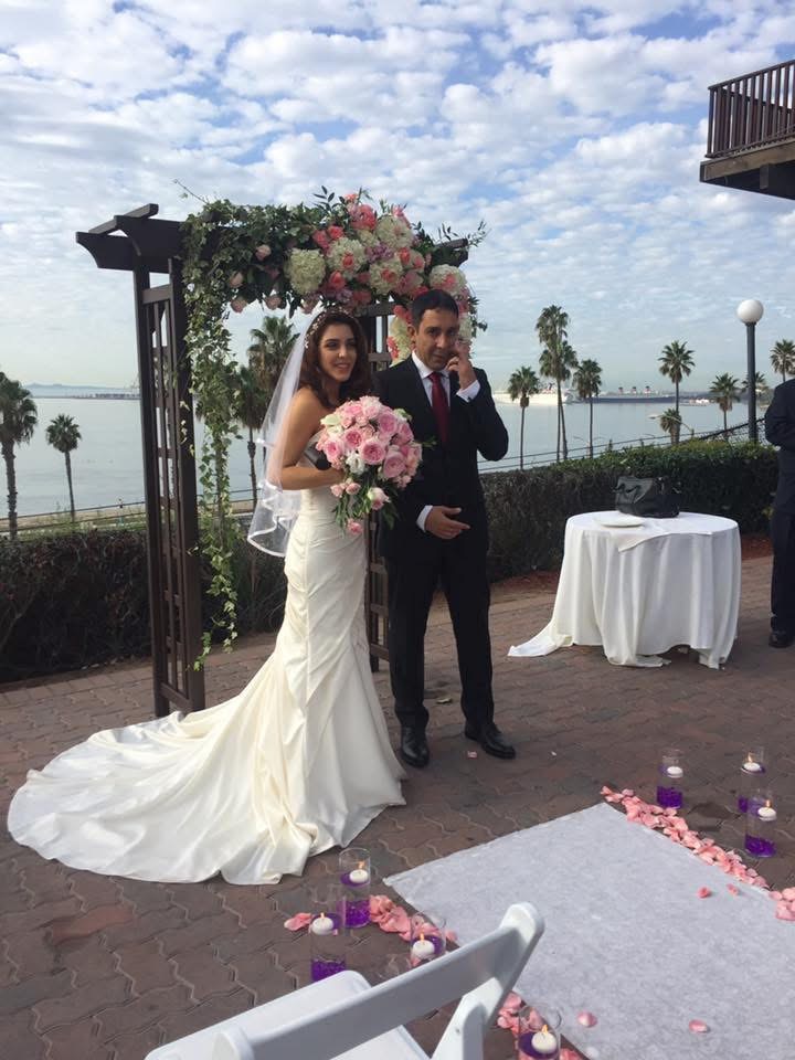 Newlyweds at an oceanfront ceremony